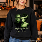 Black Frankenstein and Bride Valentine's horror sweatshirts by OrnamentallyYou, featuring retro love design for couples.