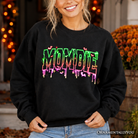 Black Mombie Halloween sweatshirt by OrnamentallyYou featuring spooky ghostly design, perfect for funny, festive mom costumes.