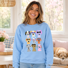 Colorful Dogs sweatshirt by OrnamentallyYou featuring vibrant dog breed designs on a summer sweater in Carolina blue.
