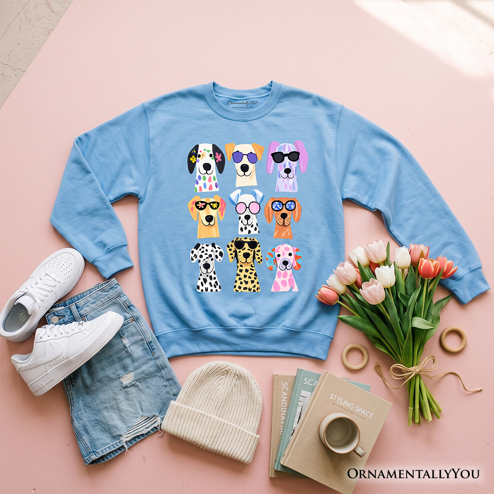 Colorful Dogs sweatshirt by OrnamentallyYou featuring playful dog breed illustrations on a Carolina blue summer sweater.