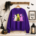 Colorful ghosts and black cats Halloween sweatshirt by OrnamentallyYou, featuring neon spooky season design on a Carolina blue background.