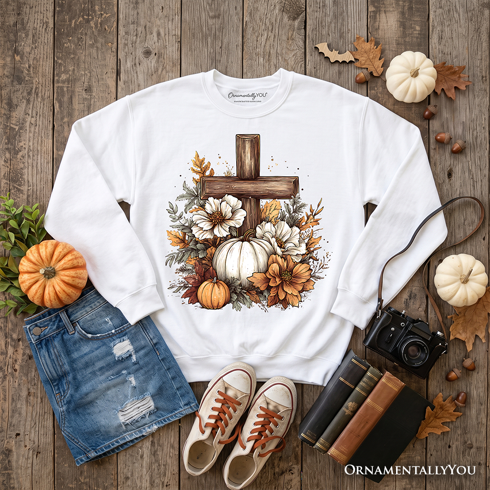 Christian Floral Pumpkin Cross Sweatshirt by OrnamentallyYou featuring a boho religious fall design and cozy sweatshirt style.