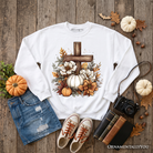 Christian Floral Pumpkin Cross Sweatshirt by OrnamentallyYou featuring a boho religious fall design and cozy sweatshirt style.
