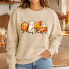 Cute fall characters sweatshirt by OrnamentallyYou featuring pumpkin, ghost, leaf, and pie designs on a cozy autumn sweater.