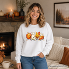 Cute fall characters sweatshirt by OrnamentallyYou featuring pumpkin, ghost, leaf, and pie designs on an autumn sweater.
