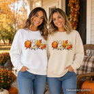 Cute fall characters sweatshirt by OrnamentallyYou featuring pumpkin, ghost, leaf, and pie designs on an autumn sweater.