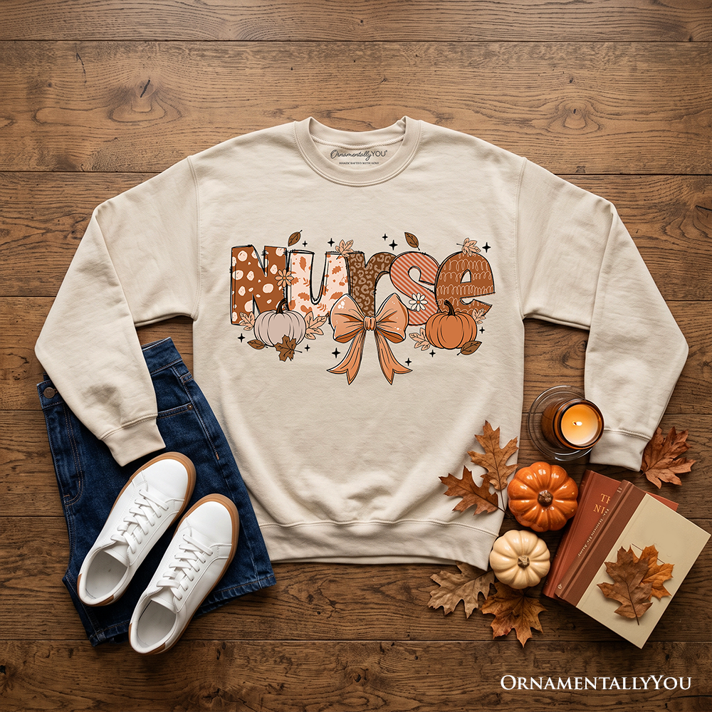 Nurse Coquette Autumn Sweatshirt with cozy fall pumpkins design, perfect for healthcare heroes, by OrnamentallyYou.