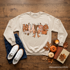 Nurse Coquette Autumn Sweatshirt with cozy fall pumpkins design, perfect for healthcare heroes, by OrnamentallyYou.
