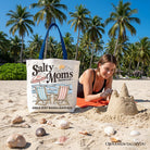 Beige Salty Moms Beach Club canvas tote bag with retro summer design, perfect for ocean-loving mothers.