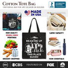 Black canvas tote bag featuring humorous "Beam Me Up This Place Sucks" comic design with retro UFO meme, perfect for women.