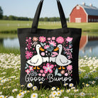 Black canvas tote bag with humorous goose and floral design, perfect for casual shopping or gifting from OrnamentallyYou.
