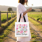 Black floral canvas tote bag featuring a funny Goose Bumps design from OrnamentallyYou, perfect for sarcastic goose gift shopping.