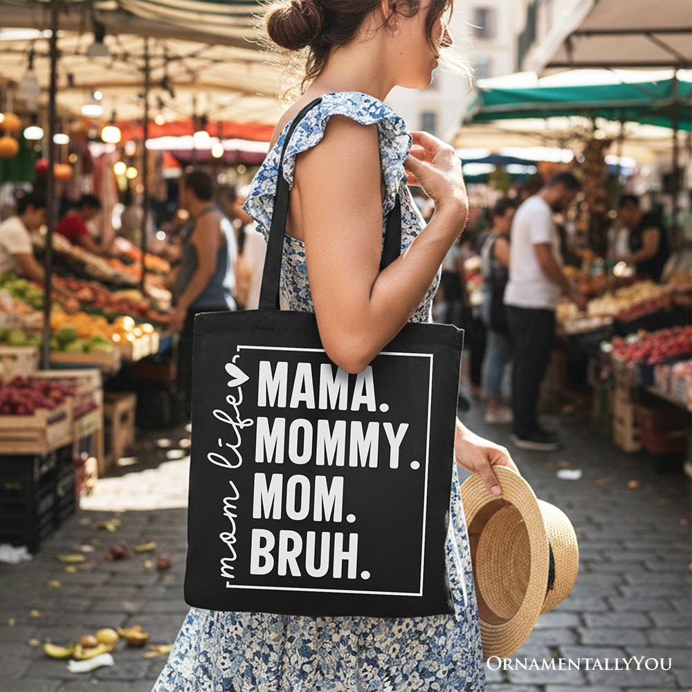 Black canvas tote bag with humorous "Mom's Life" slogan, stylish minimalist design, perfect for moms on the go.