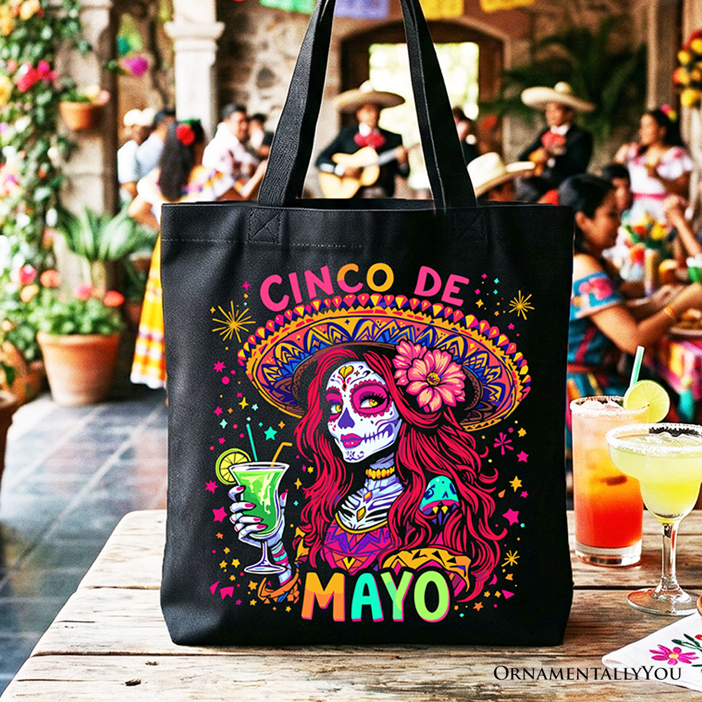 Black tote bag featuring a colorful sugar skull girl design, perfect for Cinco de Mayo celebrations and Mexican-themed gifts.