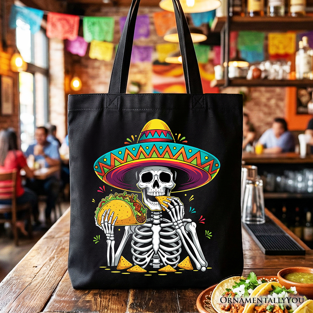 Black tote bag featuring a taco skeleton with a sombrero, perfect for Cinco de Mayo celebrations and Mexican-themed gifts.