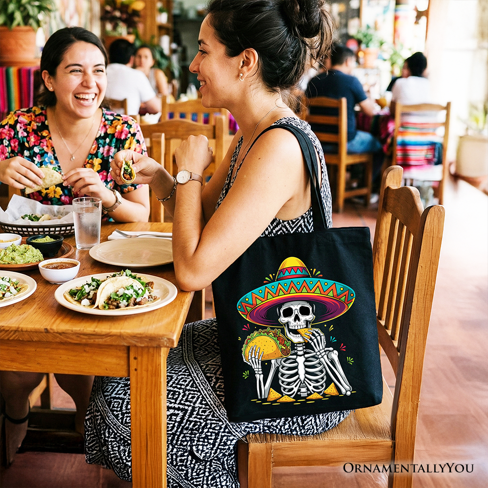 Black tote bag featuring a taco skeleton with a sombrero, perfect for Cinco de Mayo celebrations and Mexican-themed gifts.