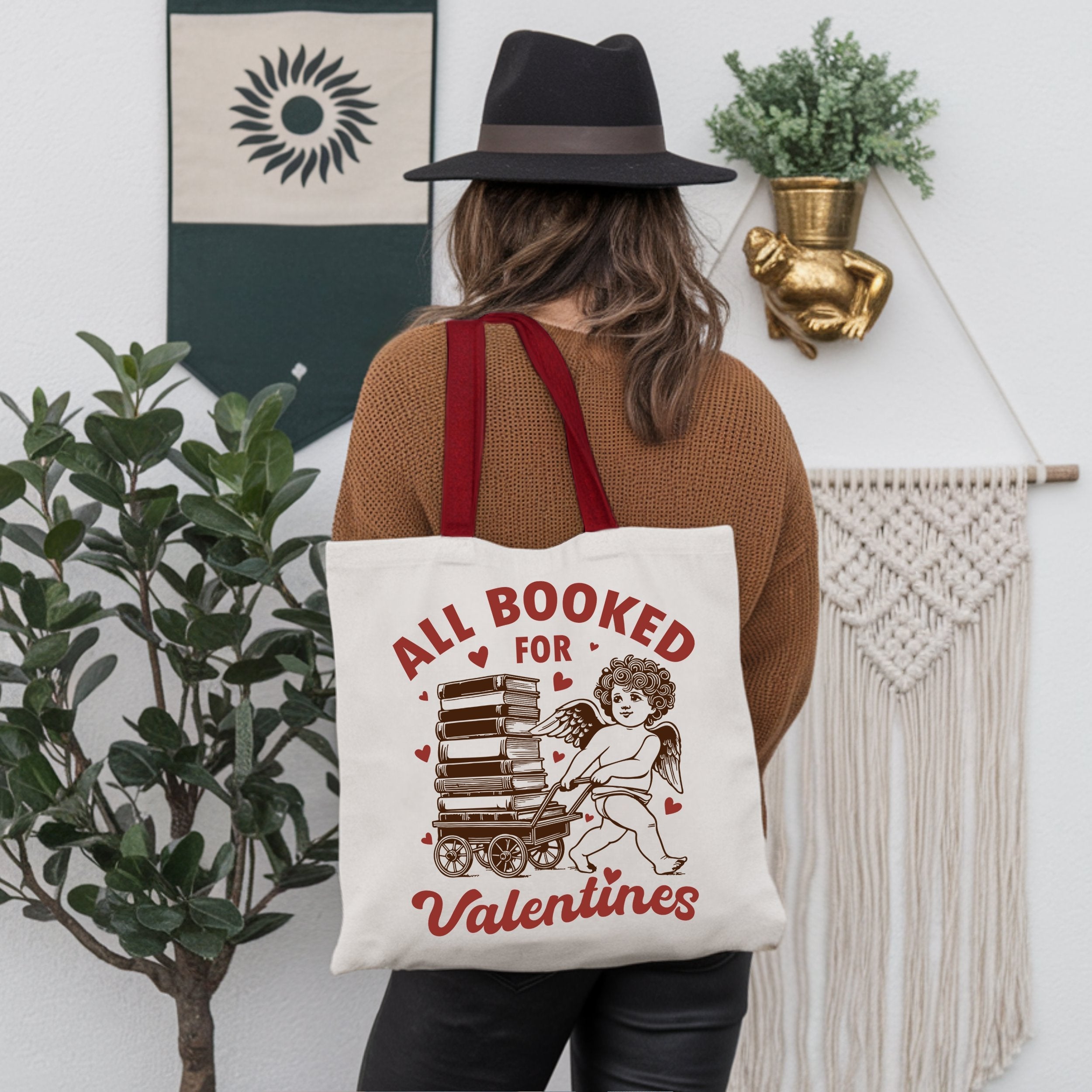 White canvas tote bag featuring a vintage Cupid design, ideal for bookworms and Valentine's Day gifts.