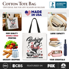 White tote bag featuring humorous "Baking Because Murder Is Wrong" design, perfect for anti-Valentine or retro kitchen gift shoppers.