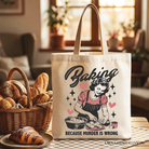 White tote bag featuring humorous "Baking Because Murder Is Wrong" text, ideal for kitchen or gift shopping, by OrnamentallyYou.