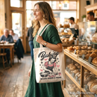 White tote bag with humorous "Baking Because Murder Is Wrong" design, perfect for retro kitchen gift or shopping.