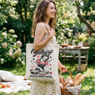 White tote bag featuring humorous "Baking Because Murder Is Wrong" design, perfect for kitchen or shopping use by OrnamentallyYou.