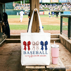 White tote bag with baseball-themed design and coquette bow, perfect for game day and casual outings.