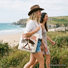 White cowgirl summer surf tote bag by OrnamentallyYou featuring retro western design, perfect for beach or casual shopping.