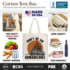 White canvas tote bag featuring humorous "Don’t Be An Armadillhole Armadillo" design, perfect for casual shopping or gift-giving.