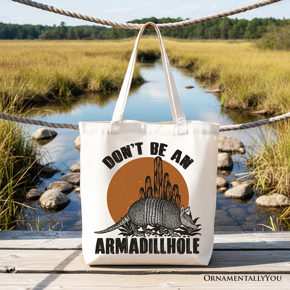 White canvas tote bag featuring a humorous armadillo design, perfect for casual shopping and Western-themed gift-giving.