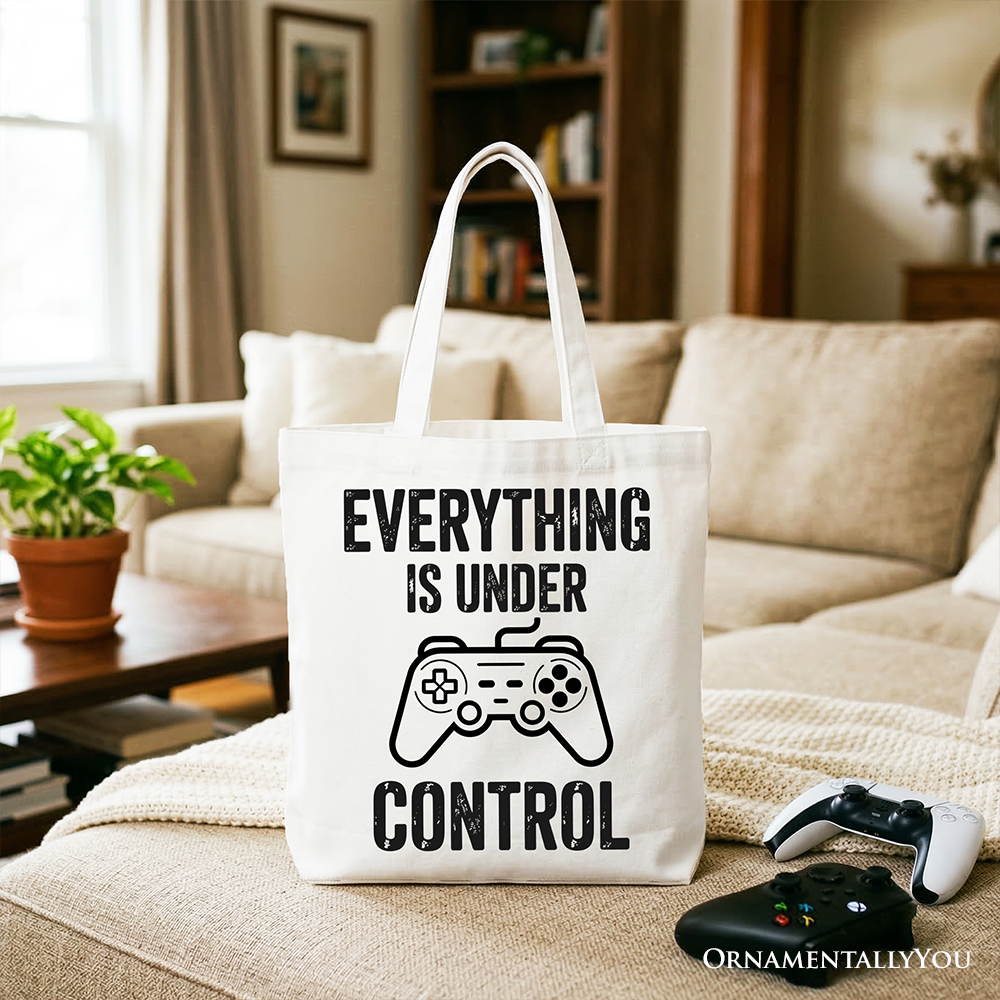 White tote bag with "Everything Is Under Control" and a video game controller design, perfect for gamers and shoppers.
