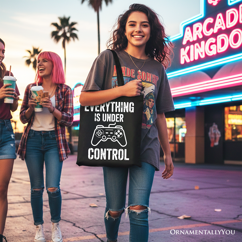 White gamer tote bag by OrnamentallyYou featuring a funny video game controller design, perfect for gamers and shoppers.