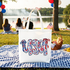 White floral USA patriotic canvas tote bag by OrnamentallyYou, ideal for 4th of July gift shopping and stylish women.
