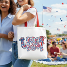 White floral USA patriotic canvas tote bag by OrnamentallyYou, perfect for 4th of July shopping and stylish women.