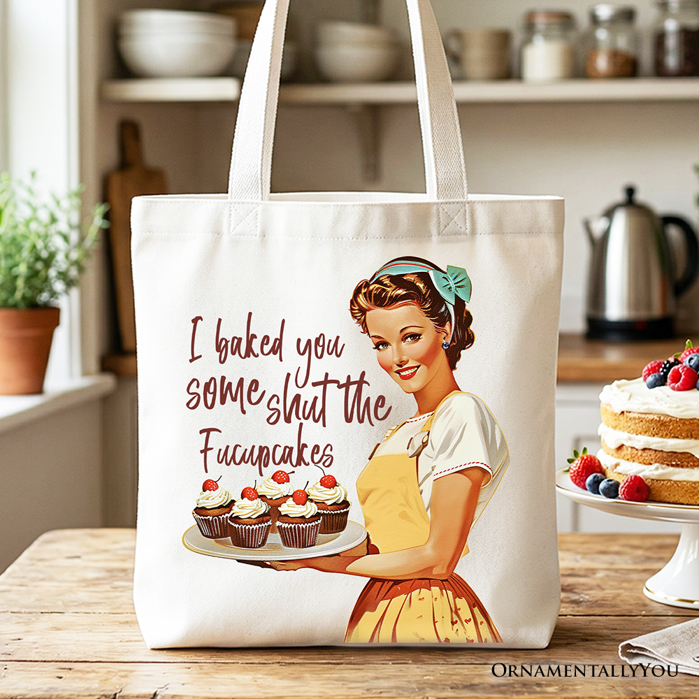 White tote bag with humorous "I Baked You Some Shut The Fucupcakes" print, perfect for quirky bakers and retro kitchen gift lovers.