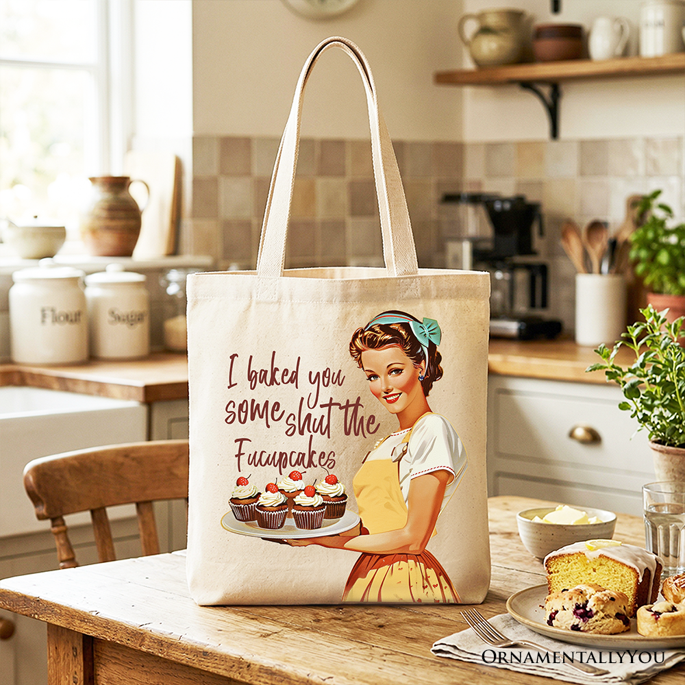 White tote bag featuring humorous "I Baked You Some Shut The Fucupcakes" design, perfect for quirky bakers and retro kitchen gifts.