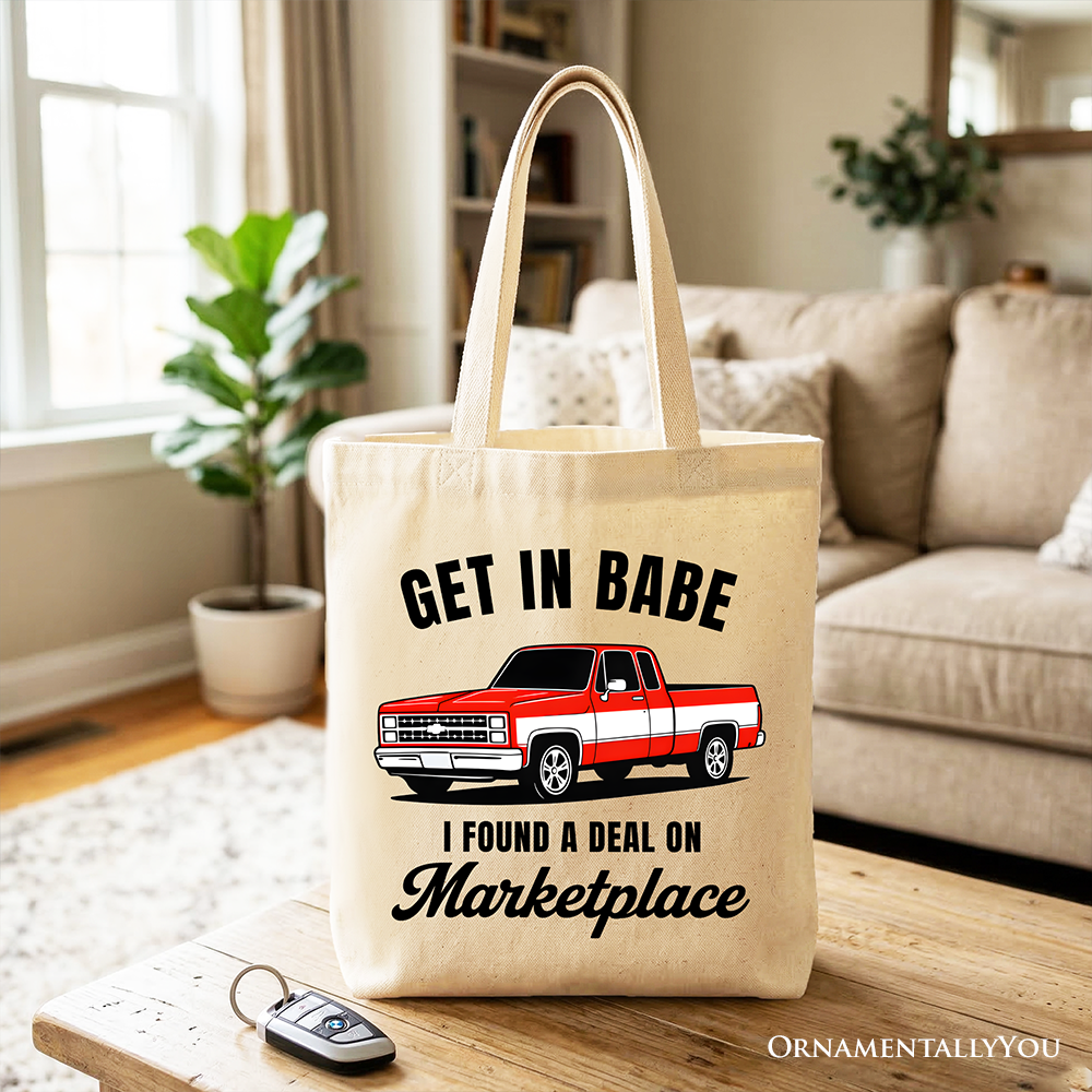 White tote bag by OrnamentallyYou featuring a funny red truck design with the text "I Found A Deal On Marketplace," perfect for shoppers.