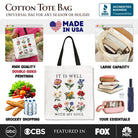 White Christian floral canvas tote bag by OrnamentallyYou with "It Is Well With My Soul" Bible verse design.