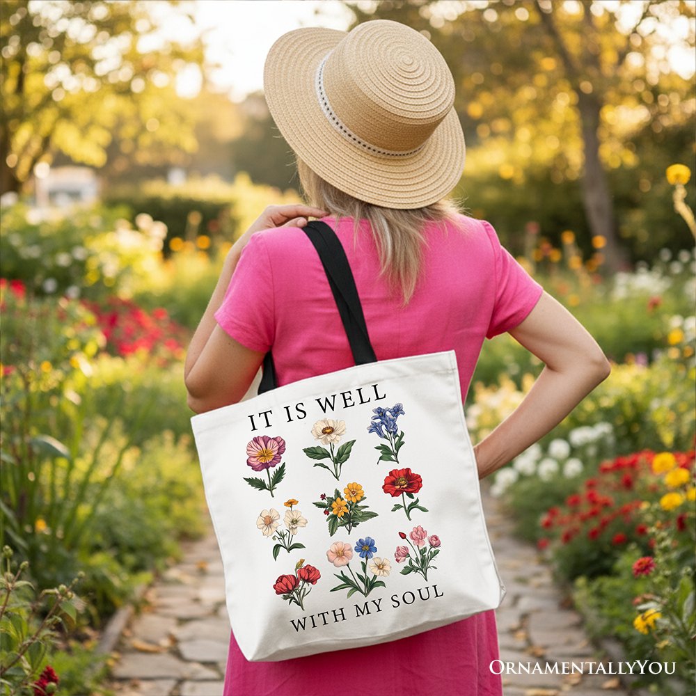 White Christian floral canvas tote bag with "It Is Well With My Soul" Bible verse design by OrnamentallyYou.