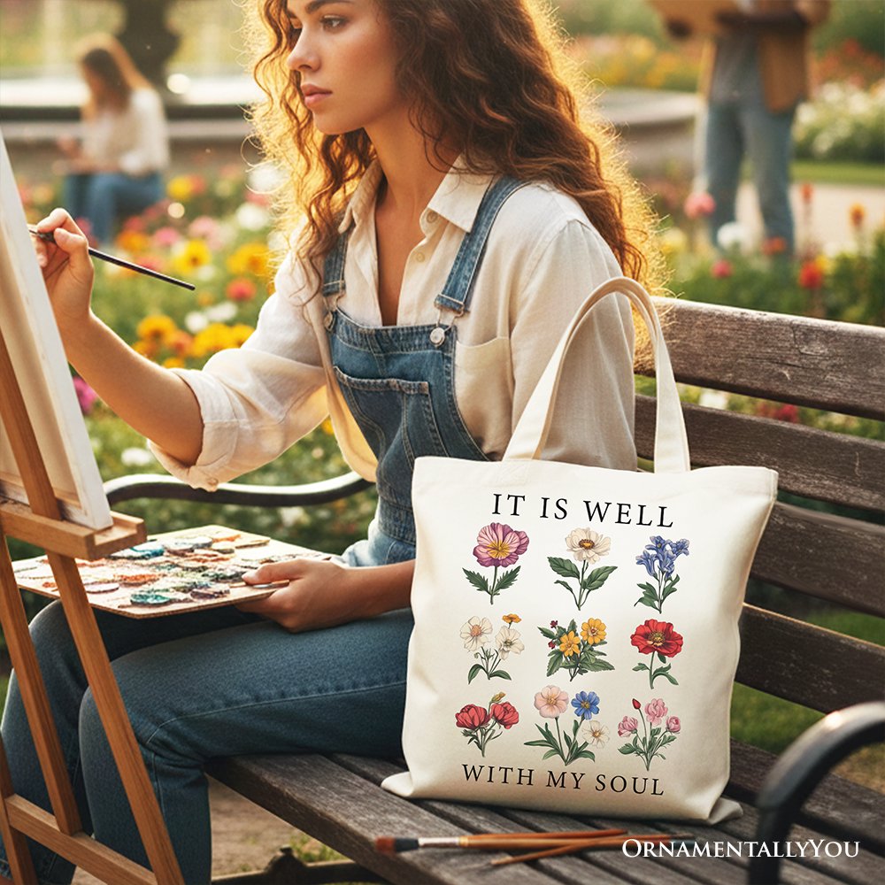 White Christian floral canvas tote bag with "It Is Well With My Soul" Bible verse design by OrnamentallyYou.