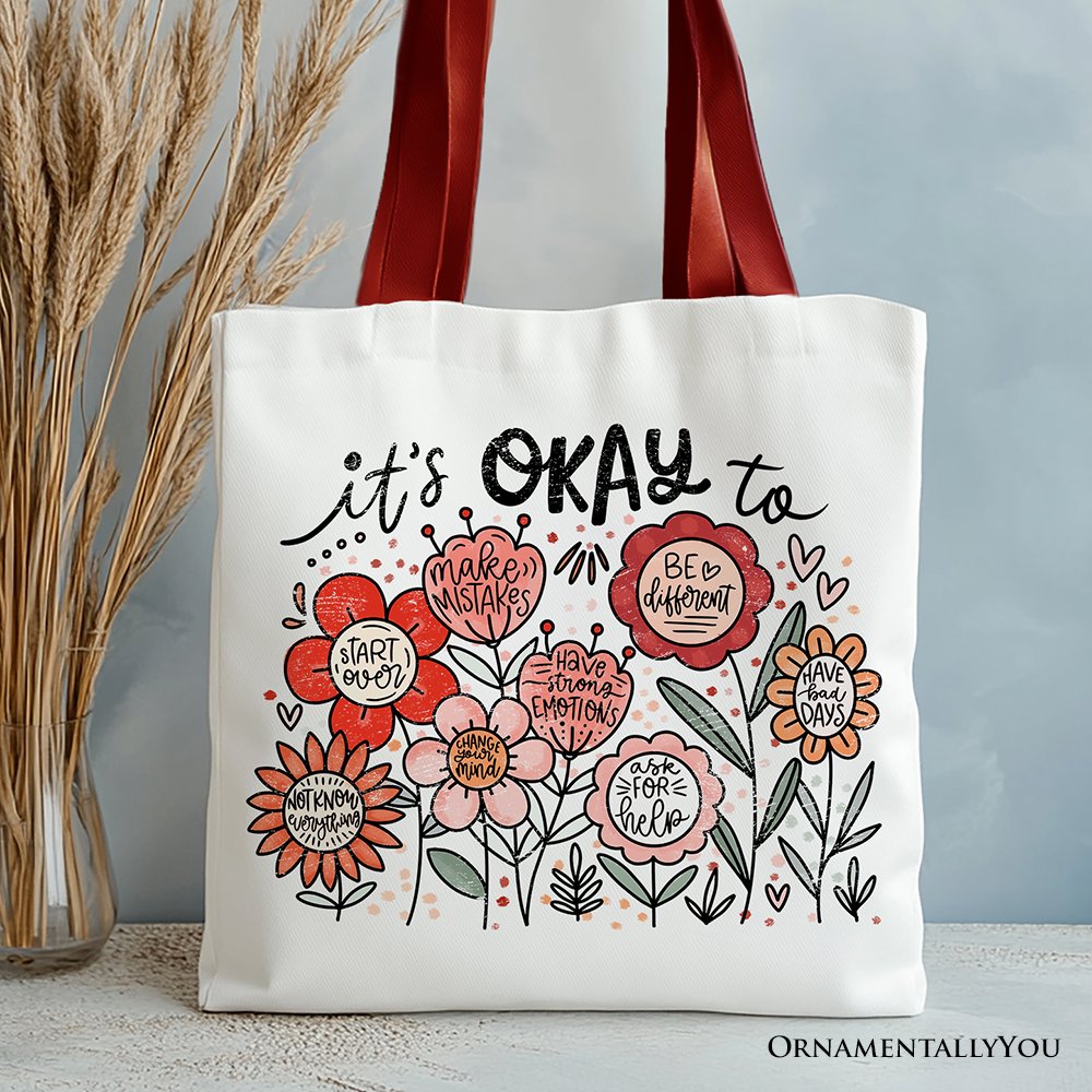 White canvas tote bag with "It's Okay" floral affirmation design by OrnamentallyYou, ideal for inspiring and kind women.