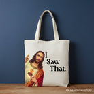 White canvas tote bag featuring whimsical Jesus "I Saw That" design, perfect for Christian gift shoppers.