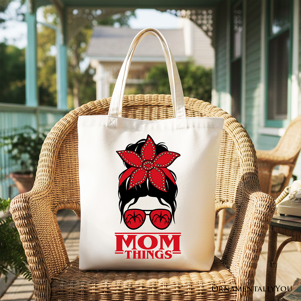 White canvas tote bag with "Mom Things" design, featuring a messy bun, retro style, red bandana glasses, family matching gift.