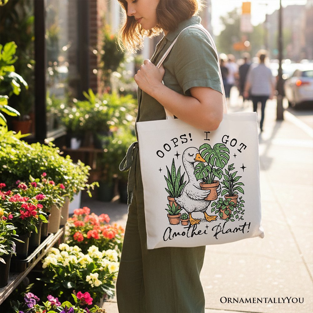 White canvas tote bag featuring humorous "Oops I Got Another Plant" goose design by OrnamentallyYou, perfect for gardening humor.