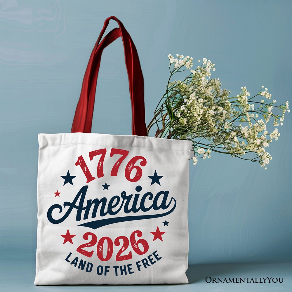 White patriotic canvas tote bag with America 1776-2026 Land of the Free design, celebrating 250 years of Independence Day.