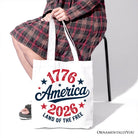 White patriotic canvas tote bag featuring "Land of the Free" design, celebrating 250 years of American independence.