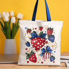 White Patriotic Boho Strawberries Bouquet canvas tote bag with 4th of July festive patch, stylish and durable for summer celebrations.