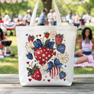 White patriotic canvas tote bag with boho strawberries bouquet and 4th of July festive patch, by OrnamentallyYou.