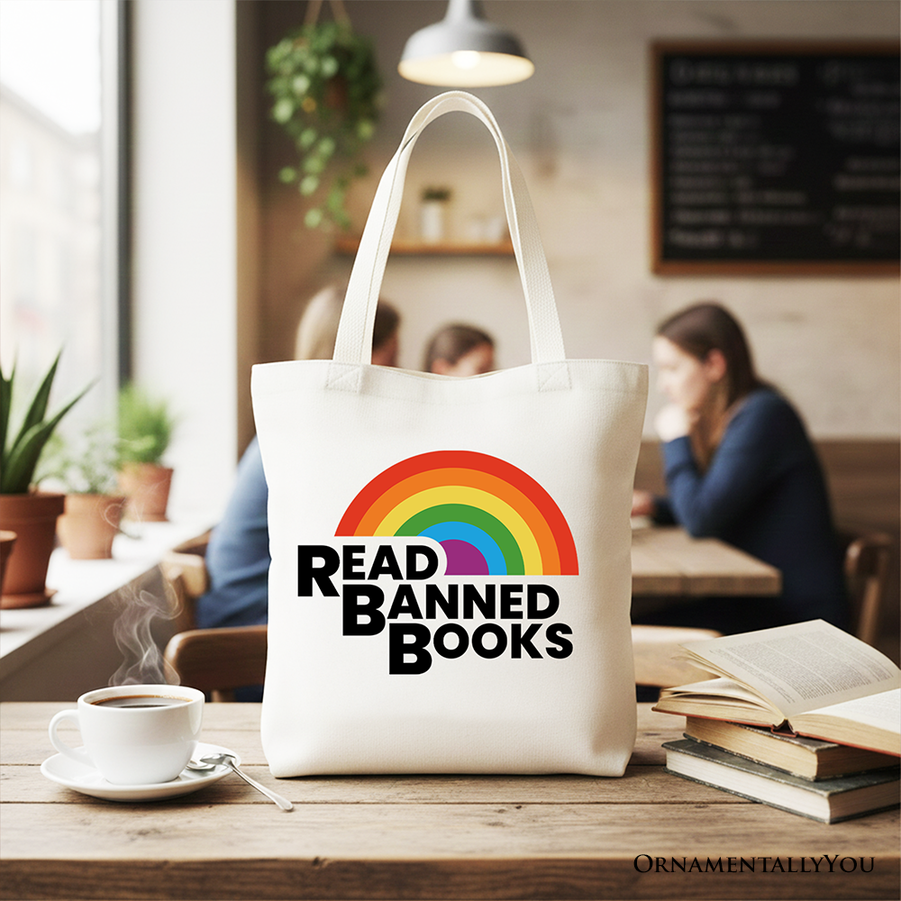 White canvas tote bag featuring a rainbow design with the phrase "Read Banned Books," ideal for book lovers and shoppers.