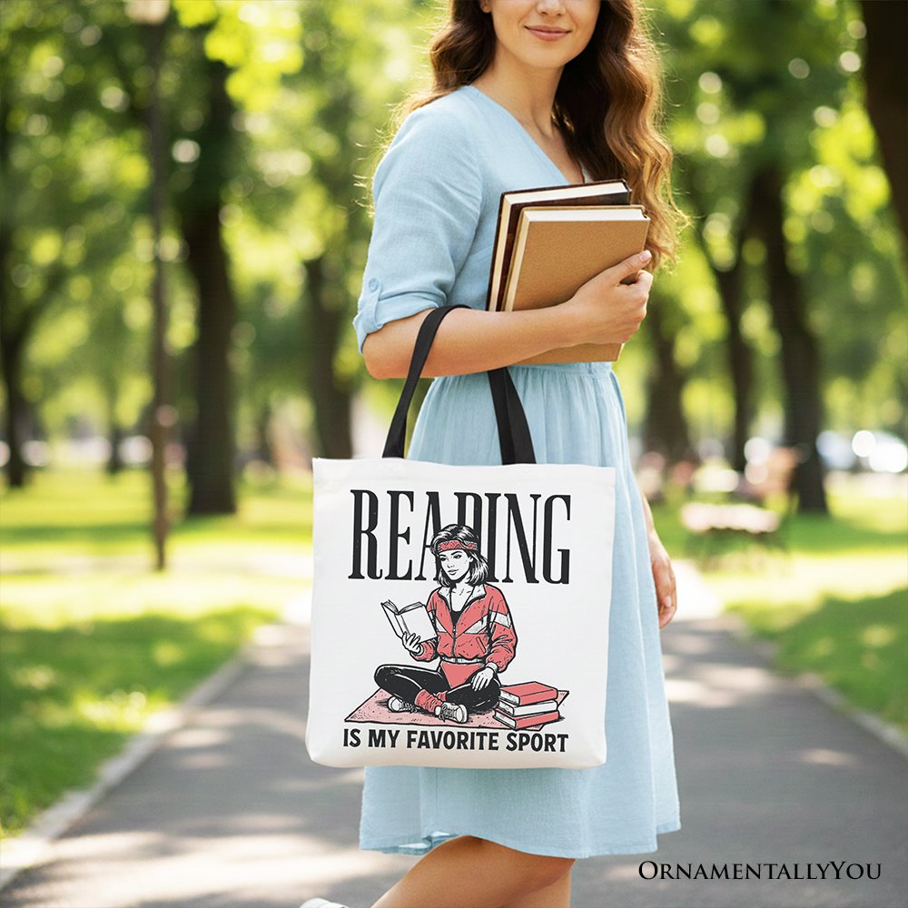 White canvas tote bag with "Reading Is My Favorite Sport" bookworm print, perfect for bibliophiles and book lovers.