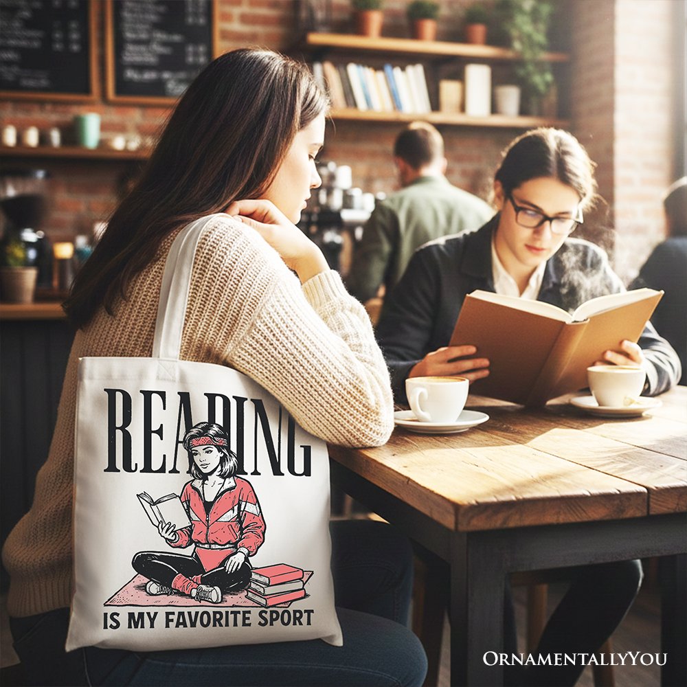 White canvas tote bag with "Reading Is My Favorite Sport" text, perfect for book lovers and bibliophiles.
